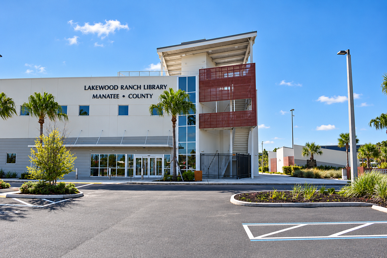 Exterior of Lakewood Ranch Library featuring modern architecture, palm trees, and landscaped grounds.