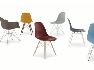 Assorted molded shell chairs in various colors and base styles displayed against a white background.