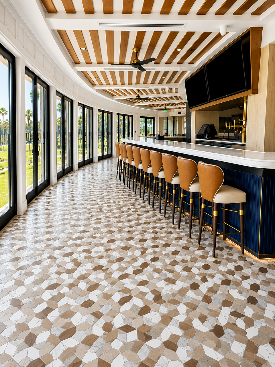 Curved clubhouse bar with patterned tile flooring, leather stools, and floor-to-ceiling windows.